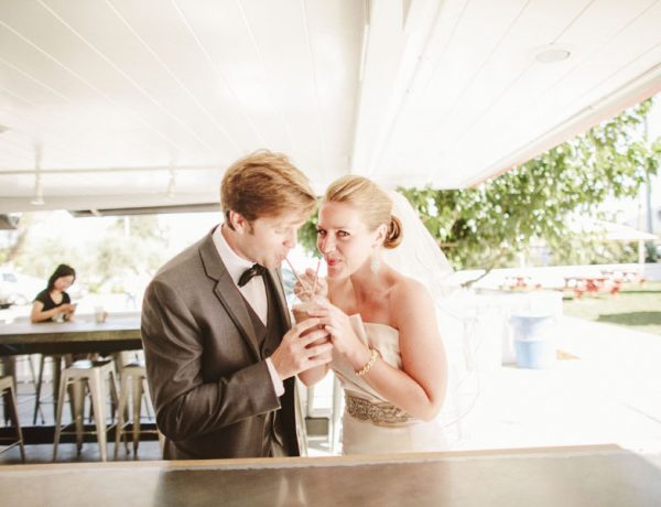 bride and groom share a shake